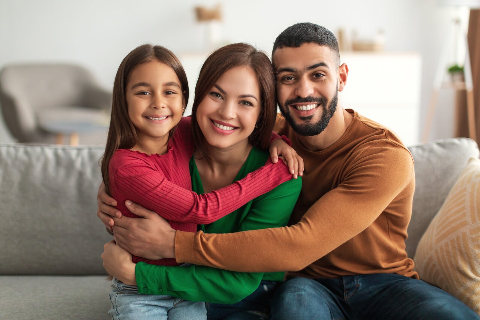 Portrait of cheerful happy Arab family smiling at home