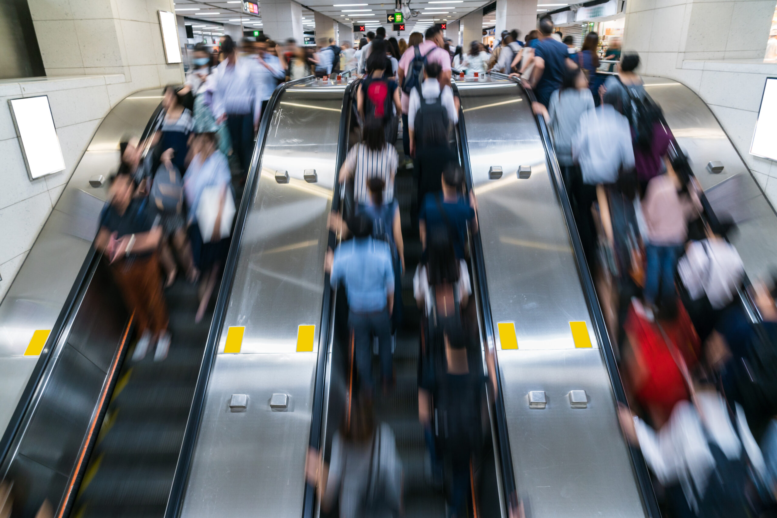 Crowd of Pedestrians Unrecognizable walking in escalator in rush